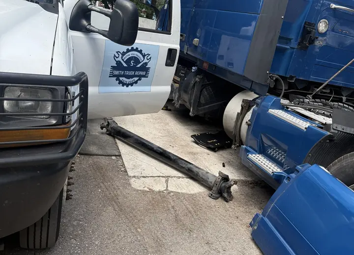 Heavy-duty truck driveshaft removed during mobile transmission service