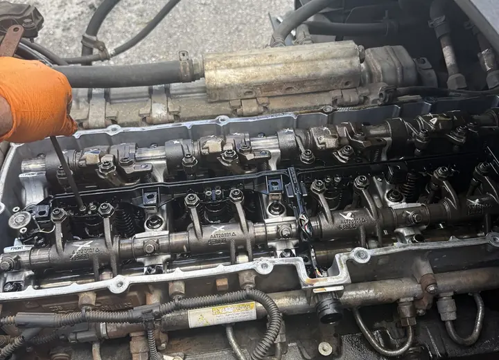 Heavy-duty diesel engine valvetrain opened for valve adjustment and inspection